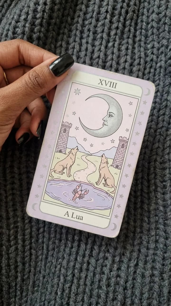 The Moon card, from the lilac deck, held over the knitted cloth
